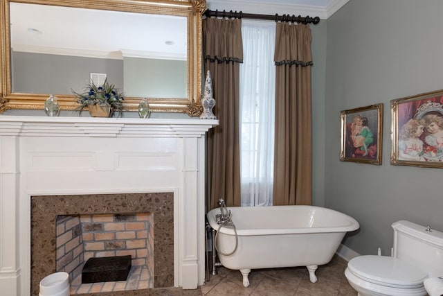 bathroom featuring ornamental molding, a washtub, a premium fireplace, tile patterned flooring, and toilet