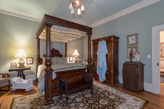 bedroom featuring hardwood / wood-style floors and ornamental molding