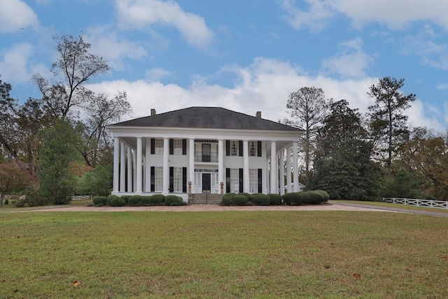 neoclassical / greek revival house with a front lawn