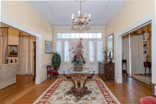 entryway featuring a notable chandelier and wood-type flooring