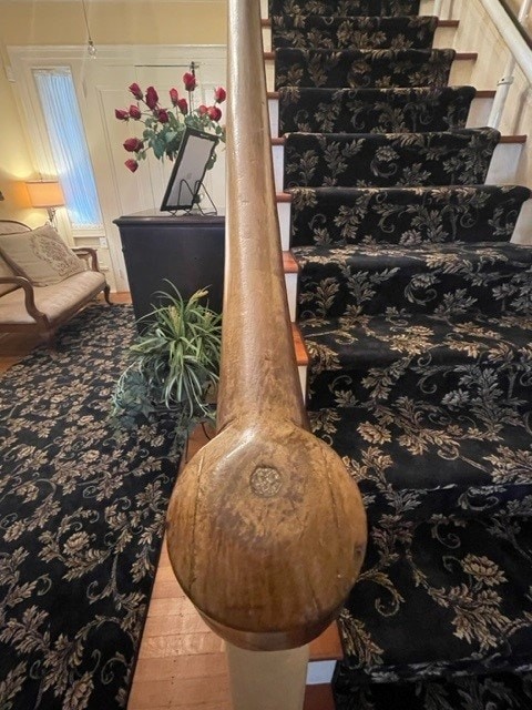 stairway with hardwood / wood-style floors