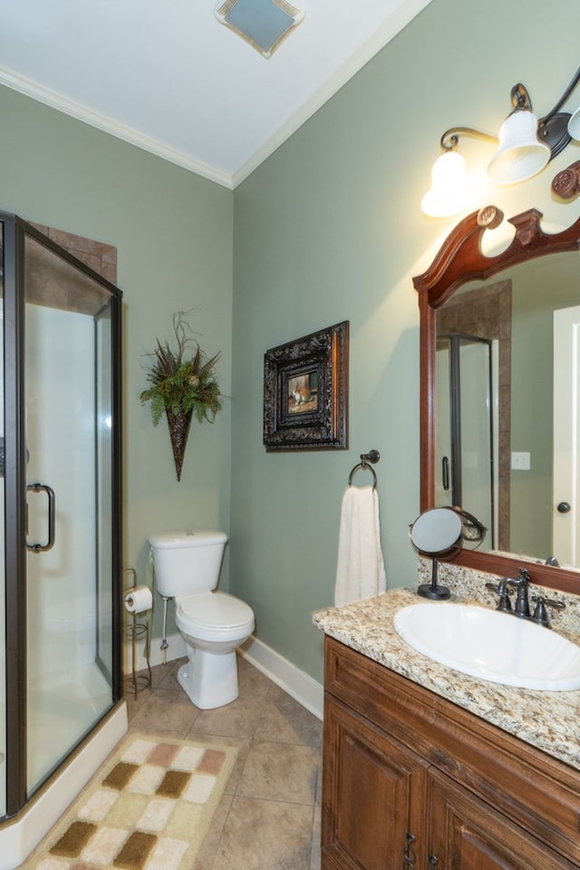 bathroom with vanity, tile patterned floors, crown molding, toilet, and an enclosed shower