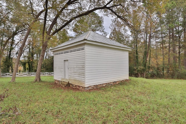 view of outdoor structure with a lawn