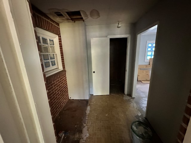 hall with brick wall