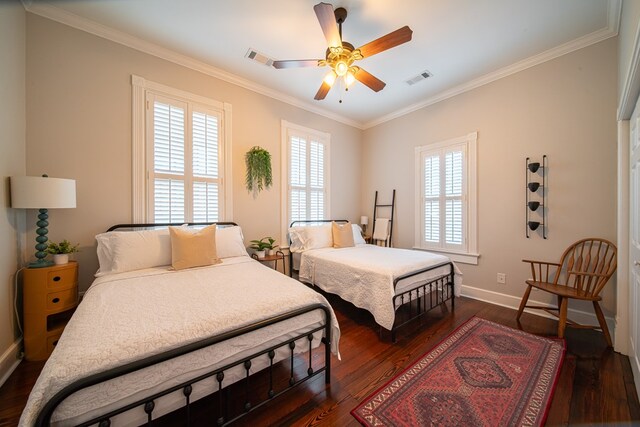 living room featuring dark hardwood / wood-style flooring, plenty of natural light, and crown molding