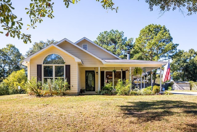 view of front of house with a carport and a front lawn