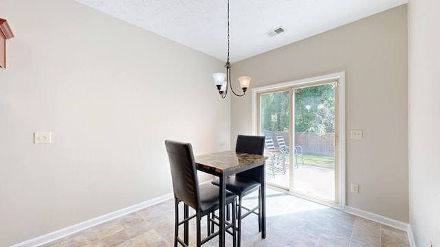650 Upland Ct, Columbus, GA 31907 - dining space featuring baseboards and a chandelier