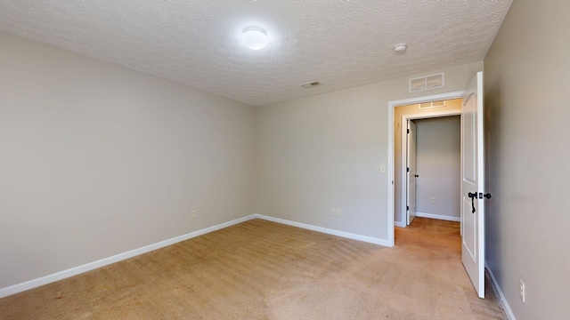 650 Upland Ct, Columbus, GA 31907 - unfurnished room featuring light colored carpet, a textured ceiling, and a smoke detector