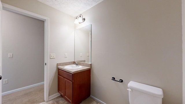 650 Upland Ct, Columbus, GA 31907 - half bathroom featuring vanity, toilet, and baseboards