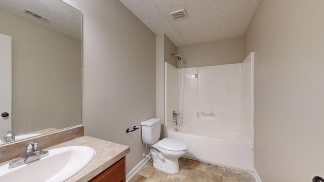 650 Upland Ct, Columbus, GA 31907 - full bath with toilet, baseboards, vanity, washtub / shower combination, and a textured ceiling