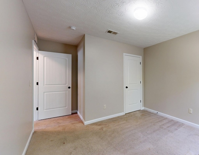 650 Upland Ct, Columbus, GA 31907 - spare room with light carpet, baseboards, a textured ceiling, and a smoke detector