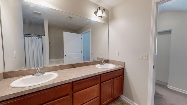 650 Upland Ct, Columbus, GA 31907 - bathroom featuring double vanity, baseboards, and a shower with curtain