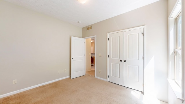 650 Upland Ct, Columbus, GA 31907 - unfurnished bedroom with light carpet, baseboards, and a closet