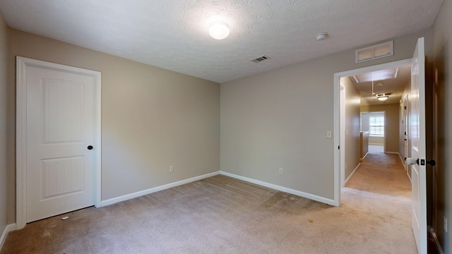 650 Upland Ct, Columbus, GA 31907 - empty room featuring attic access, light carpet, and a textured ceiling