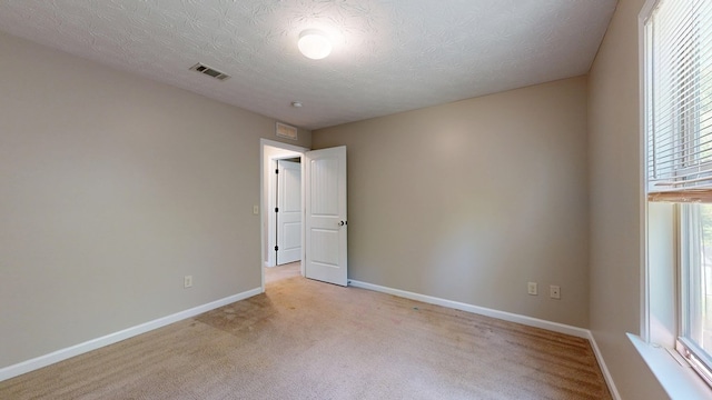 650 Upland Ct, Columbus, GA 31907 - empty room featuring light colored carpet, baseboards, and a textured ceiling