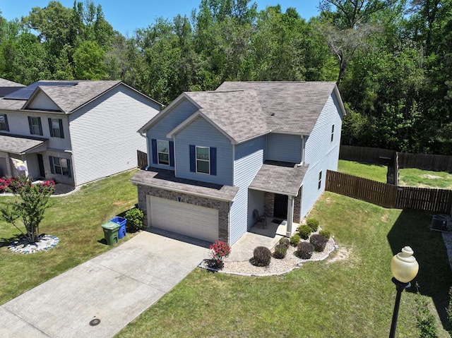 650 Upland Ct, Columbus, GA 31907 - traditional-style home featuring an attached garage, driveway, roof with shingles, and brick siding