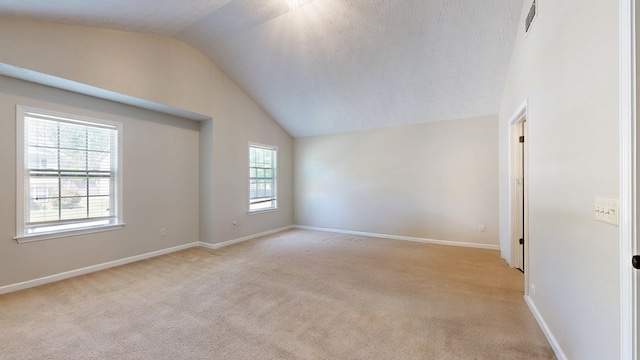 650 Upland Ct, Columbus, GA 31907 - spare room featuring lofted ceiling, light carpet, and baseboards