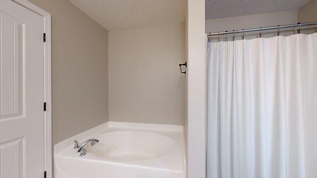 650 Upland Ct, Columbus, GA 31907 - full bathroom featuring a garden tub and a textured ceiling