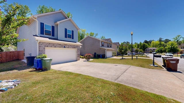 650 Upland Ct, Columbus, GA 31907 - traditional home with an attached garage, driveway, and brick siding