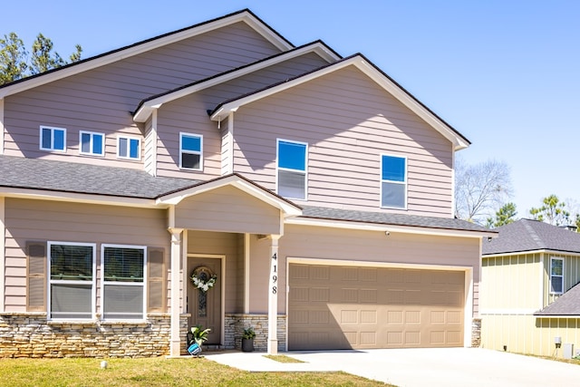 craftsman inspired home featuring driveway, stone siding, and a garage