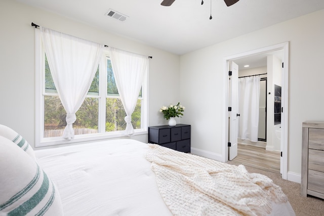 bedroom featuring a ceiling fan, baseboards, carpet floors, and visible vents
