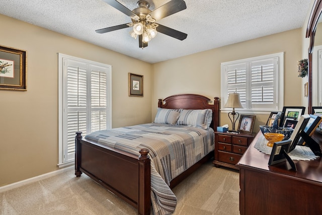 3406 Seminole Dr, Columbus, GA 31907 - bedroom featuring light colored carpet, a ceiling fan, and a textured ceiling