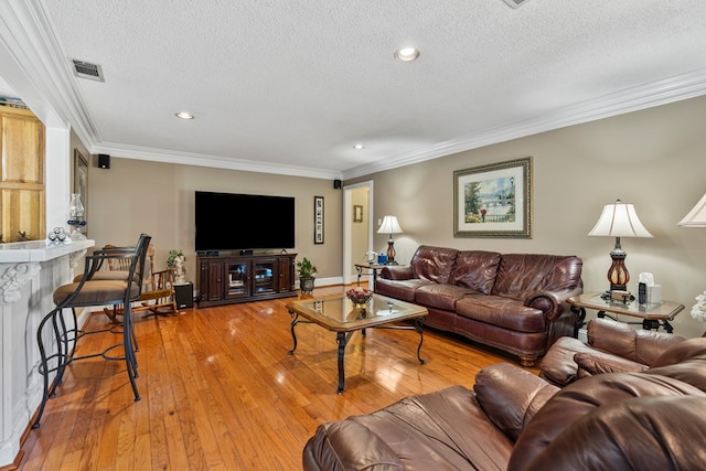 3406 Seminole Dr, Columbus, GA 31907 - living area featuring a textured ceiling, crown molding, light wood-style flooring, and recessed lighting