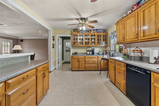 3406 Seminole Dr, Columbus, GA 31907 - kitchen with a textured ceiling, dishwasher, ceiling fan, brown cabinets, and light tile patterned floors
