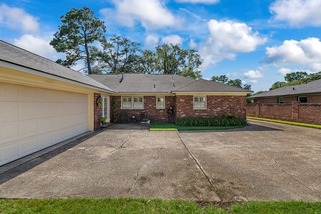 3406 Seminole Dr, Columbus, GA 31907 - back of house with brick siding and asphalt driveway
