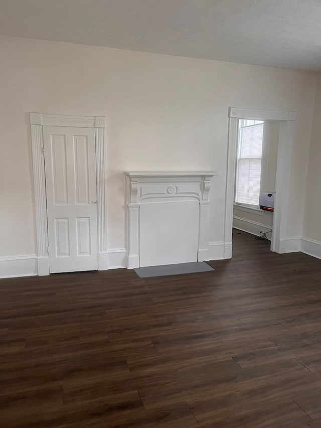 1348 Rhodes St, Columbus, MS 31901 - unfurnished living room featuring dark wood-type flooring