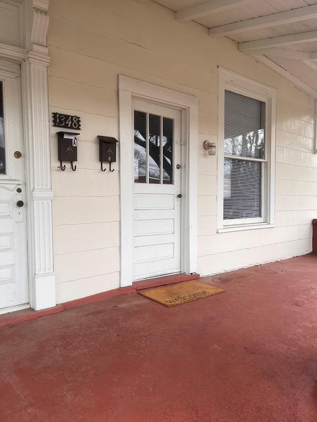 1348 Rhodes St, Columbus, MS 31901 - view of exterior entry featuring a porch