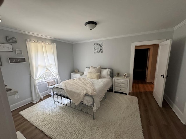 bedroom featuring ornamental molding and dark hardwood / wood-style flooring