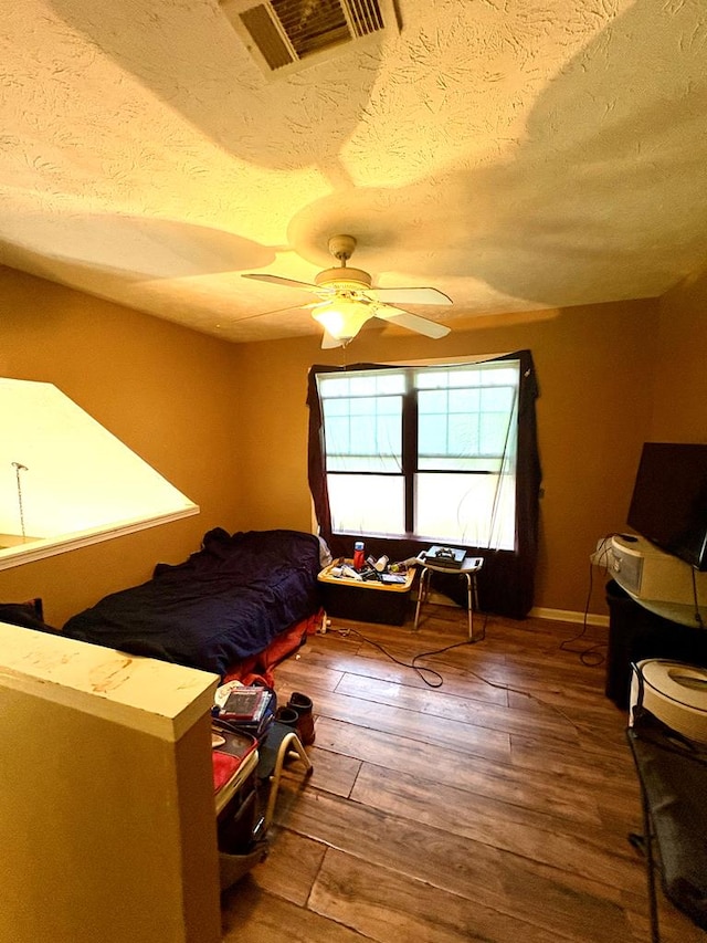 102 Parker St, Lagrange, GA 30240 - bedroom with hardwood / wood-style floors, a textured ceiling, and ceiling fan