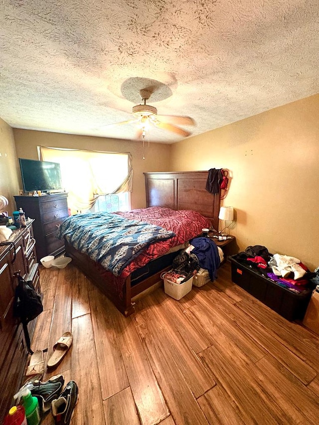 102 Parker St, Lagrange, GA 30240 - bedroom with wood finished floors, a textured ceiling, and a ceiling fan