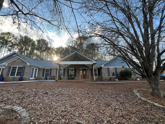 single story home with covered porch