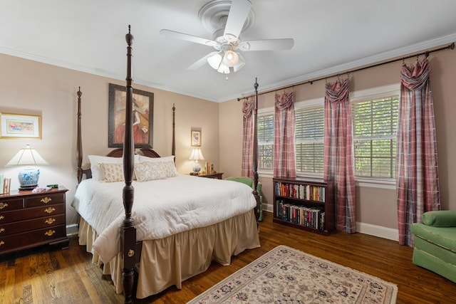 bedroom with ceiling fan, dark hardwood / wood-style flooring, and ornamental molding