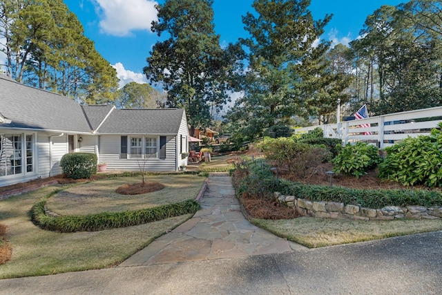 view of property exterior featuring a lawn