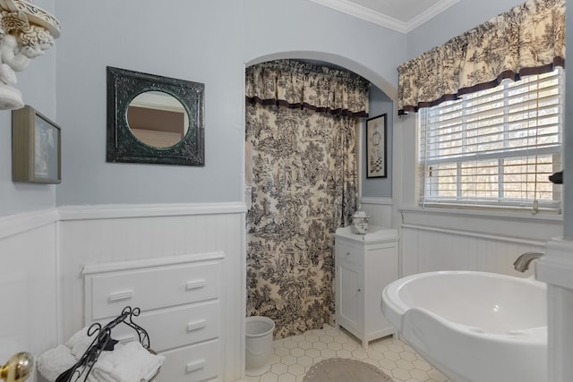 bathroom with tile patterned floors and ornamental molding