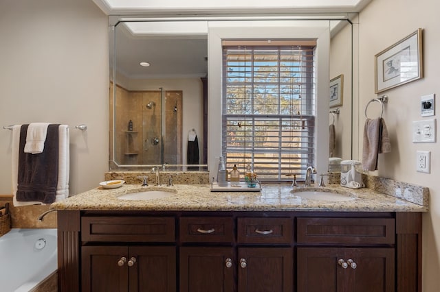 bathroom with crown molding, vanity, and shower with separate bathtub