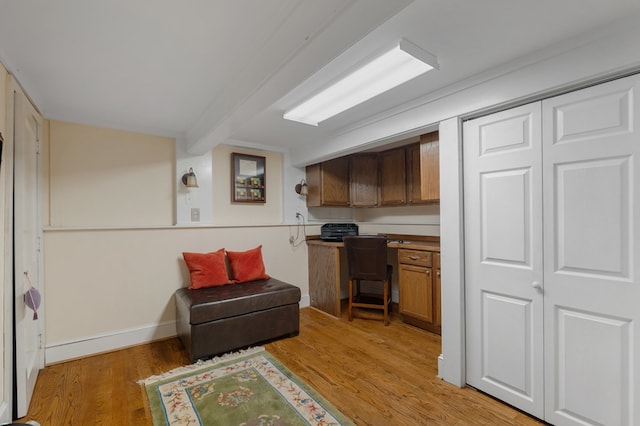 kitchen with light hardwood / wood-style floors and beam ceiling