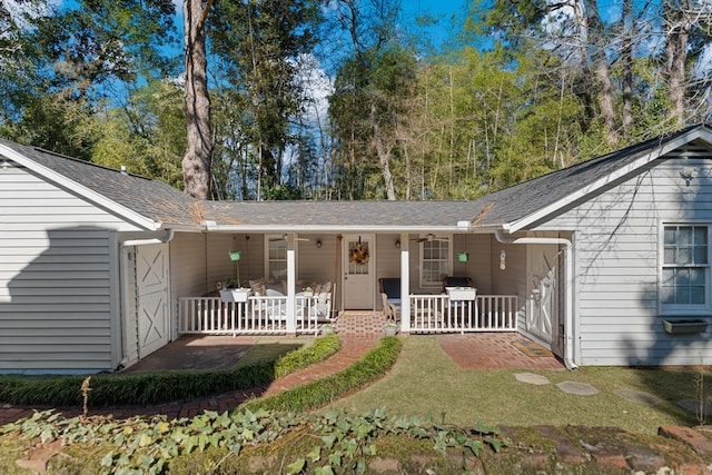 ranch-style home with covered porch and a front lawn