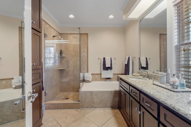 bathroom with tile patterned floors, crown molding, vanity, and independent shower and bath