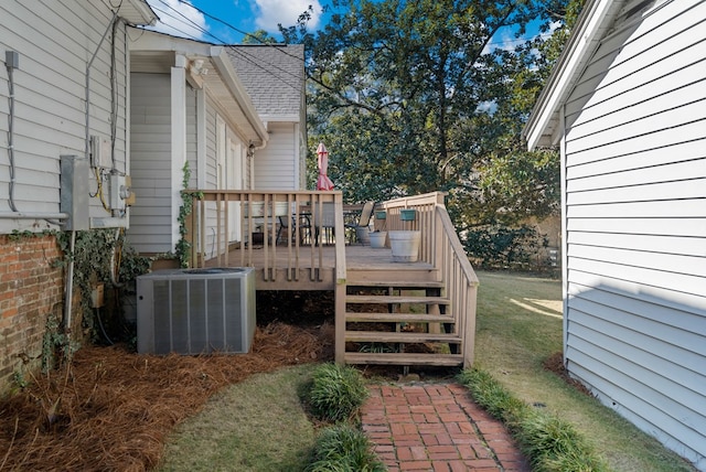 wooden terrace featuring central air condition unit