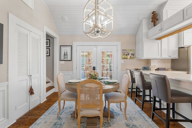 dining room featuring wooden ceiling, dark hardwood / wood-style floors, french doors, and an inviting chandelier