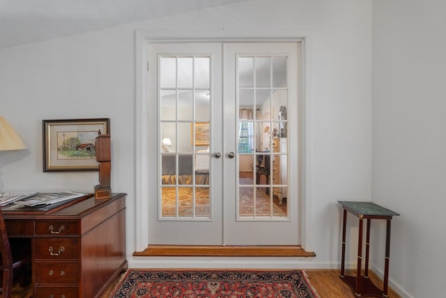 doorway to outside with french doors and hardwood / wood-style floors