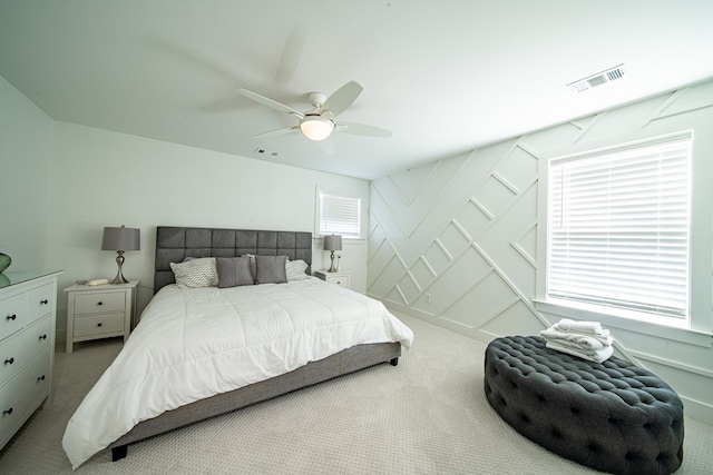 bedroom with a ceiling fan, visible vents, and carpet flooring