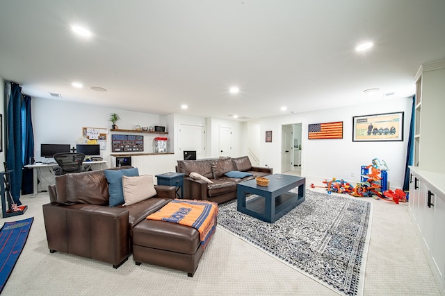 living area featuring light carpet, visible vents, and recessed lighting