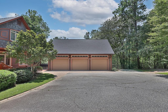 9250-11 River Rd, Fortson, GA 31808 - view of front facade featuring asphalt driveway, an outbuilding, and an attached garage