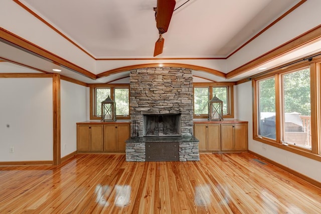 9250-11 River Rd, Fortson, GA 31808 - unfurnished living room featuring a stone fireplace, light wood-style floors, and crown molding