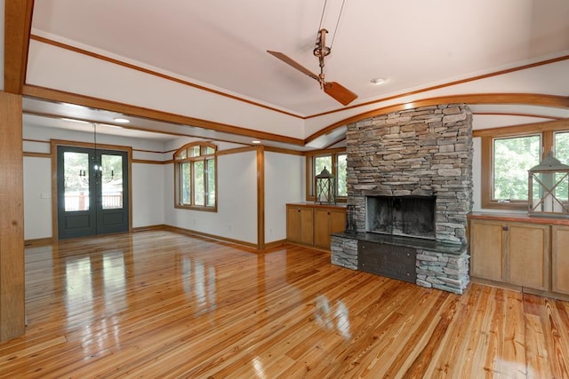 9250-11 River Rd, Fortson, GA 31808 - unfurnished living room with french doors, light wood finished floors, a stone fireplace, healthy amount of natural light, and crown molding
